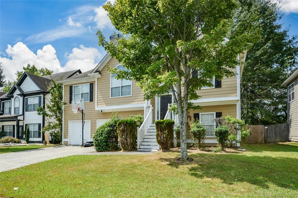 Welcome Home to this 4 Bedroom, 3 Bath Property in Sought-After Cobb County!. Built in 2001, This Home Offers Fresh Interior Paint with A Bright and Inviting Floor Plan. Designer Touches Throughout the Home Includes A Stunning Foyer Chandelier, Tiled-Surround Fireplace, Sliding Barn Door, Farmhouse Kitchen Sink, Upgraded Light Fixtures..Just to Name A Few! The Terrace Level Expands The Living Space with a Versatile Family/Media Room, Additional Bedroom, Full bath, and Walk-In Laundry Room. The Spacious Fenced Backyard is Perfect for Outdoor Entertaining, Pets, or Gardening. Enjoy the Convenience of a Prime Marietta Location Close to Shopping, Dining, Schools, and Major Highways. Move-in ready and Waiting for Its New Owner! This Home is a Great Opportunity to Settle into The Desirable Cumberland Creek Community and Make It Your Own. Call Today!!