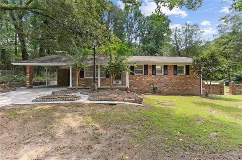 Photo of 7039 Rockbridge Road, Stone Mountain, GA 30087 (MLS # 7613137)