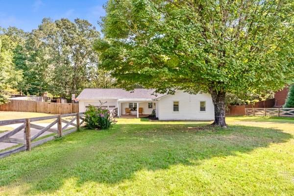 Picturesque ranch on over half an acre in LAKE LANIER ACCESS neighborhood w/no HOA! This charming 3BR/2BA home features newly painted interior and exterior, new floors throughout, large living room with vaulted ceilings, newly renovated secondary bath, open kitchen with new appliances and more. Enjoy coffee on the private back porch overlooking large, cleared backyard with recently added privacy fence. Plenty of storage in 2 car garage for all your water toys and double gate access to allow room in the back for boat. Walk to Little Ridge Park with boat ramp and pet friendly trails that run along the shoreline. Minutes to shopping, restaurants, parks, etc. This home has it all!