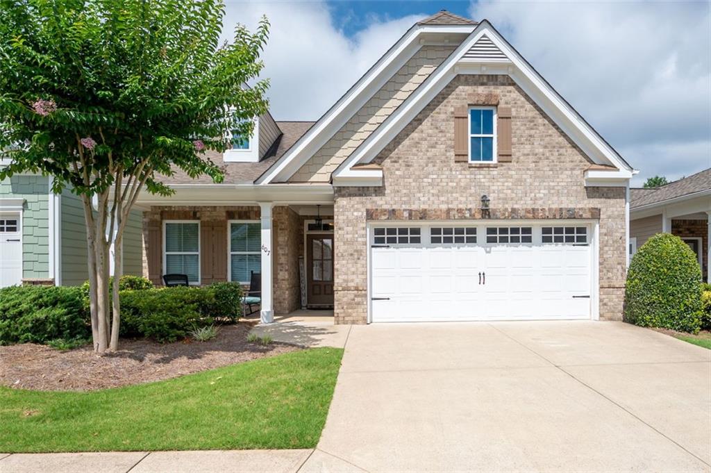 Welcome to 607 Abbey Road in beautiful Woodstock, GA! This move-in ready 3-bedroom, 3-full-bath home offers comfortable living with a bright, open layout and thoughtful design throughout. The spacious main level features a fireside living room, a well-appointed kitchen with ample cabinet space, and a dining area that flows seamlessly for easy entertaining. Retreat to the oversized primary suite with a private bath and generous closet space. Two additional bedrooms and full baths provide flexibility for guests, a home office, or multigenerational living. Enjoy peaceful mornings on the patio or take advantage of the neighborhoods fantastic amenities including a pool, clubhouse, and well-kept common areas. Located just minutes from downtown Woodstock, shopping, restaurants, and easy access to I-575. This home combines low-maintenance living with modern comfort in one of Cherokee County s most desirable communities. Schedule your showing today!