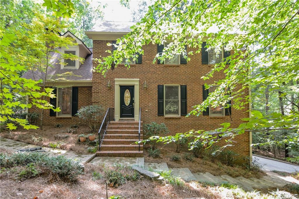 Timeless Brick Beauty on One of Norcross’s Most Picturesque Streets
Nestled just moments from the heart of historic downtown Norcross, this classic four-sided brick home offers the perfect blend of privacy, character, and opportunity. Set on a lush 1.5-acre lot — which includes an adjacent half-acre parcel (R6273-055) — the property features a gently rolling creek, mature trees, and a sparkling pool surrounded by serene landscaping.
Inside, the traditional layout welcomes you with a gracious foyer, leading to a formal living room and adjoining dining room — ideal for entertaining. At the rear of the home, enjoy a cozy fireside family room, a sunlit kitchen, and a charming sunporch overlooking the pool and natural surroundings. A convenient laundry area is located just off the kitchen. Hardwood floors throughout the main level
Upstairs, the primary suite offers a ensuite bath and accompanied by three additional bedrooms and a full bath. Whether you’re dreaming of a spa-inspired retreat or an expanded walk-in closet, there’s ample potential to reconfigure the layout to suit your lifestyle. The kitchen also offers exciting possibilities for expansion and customization.
Additional highlights include a generous garage with built-in storage and the rare bonus of a second lot — perfect for gardening, play and privacy.
Why Norcross?
This beloved town is known for its walkable downtown, vibrant dining scene, boutique shopping, scenic parks, and a welcoming community garden. Whether you’re seeking tranquility or connection, this home places you at the center of it all.