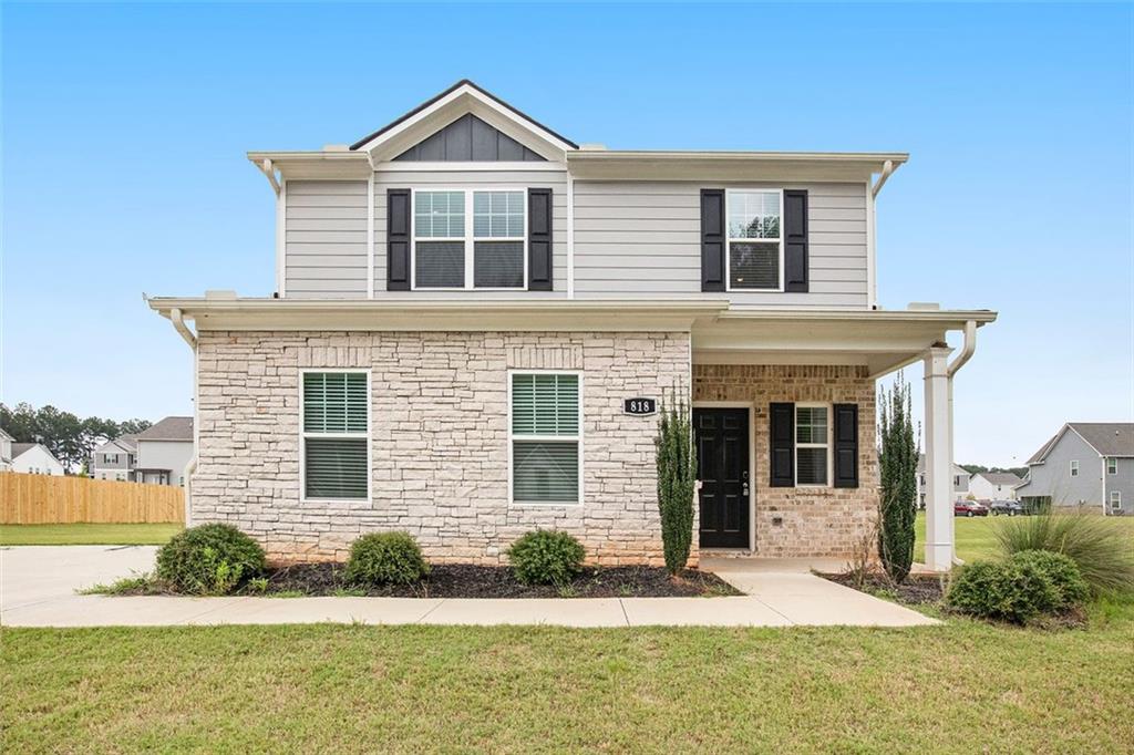 Like-new 3-bedroom, 2-bathroom single-family home built in 2022. This two-story home features a two-car garage and modern finishes throughout. The first floor offers durable LVP flooring, while the second floor is carpeted. The kitchen includes stainless steel appliances, granite countertops, and ample cabinet space. Open living and dining areas provide a functional layout for daily living. Bedrooms are located upstairs, including a spacious primary suite.