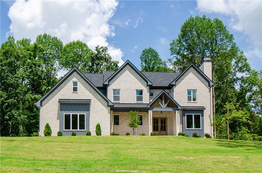 Immaculate New Construction Home In Lexington Mill Nestled On 1.06 Acres Of Gorgeously Landscaped Grounds. No Expense Was Spared When Building This Dream Home! Step Inside To Custom Wood Paneled Foyer And Family Room With Elegant Lighting Fixtures And Beamed Ceilings. Fireside Formal Family Room Can Easily Serve As An Executive Office. Open Concept Layout Can Be Tailored To Any Lifestyle! Built In Speakers Throughout The Home.The Covered Deck On The Main Level Is Perfect For Entertaining Rain Or Shine! Chef’s Kitchen Boasts Top Of The Line Appliances, Dual Sinks (Farmhouse And Prep Sink), Pot Filler, Custom Cabinetry, Backsplash, Counters, Built In Phone Chargers And Under Island Lighting That Flows Into The Formal Dining Room With Built-Ins For Dinnerware, Decor and Storage! A Mudroom And Powder Room Complete The Main Level. Upstairs, The Luxurious Master Suite Features A Morning Bar, Wood Paneled Lighted Tray Ceilings, Acoustic Slat Paneled Fireplace That Ties Together With The Tile Accents Behind The Stand Alone Tub And Shower Bench. Intricate Marble And Heated Neutral Floors Tie Together This Masterpiece Living Space. The Huge Walk In Closet Has Custom Shelving As Does Every Closet In This Amazing Home! Three Additional Generously Sized Bedrooms ( One With An En-suite Bath And The Other Two Share A Jack And Jill Style Bath) Complete The Upstairs. The Laundry Room With Custom Shelving And A Sink Is Also Conveniently Located On The Second Floor. The Basement Already Has A Finished Bath With A Bedroom And Flexspace For Anything You Have In Mind. The Unfinished Space Can Be A Movie Theater, Additional Bedrooms Or Space For Hobbies. The Double Doors Lead Out To A Second Covered Patio Overlooking A Private Backyard That Has Room And Potential For An Infinity Style (Or Any Style) Pool! Located Minutes From I-85, Chateau Elan Winery, Shopping, Dining Hospitals, And More!