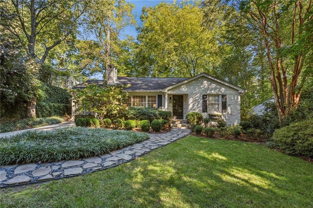 Charming Collier Hills Cottage Near the BeltLine & Tanyard Creek Park.
Come live in the heart of beloved Collier Hills—just steps from the BeltLine and Tanyard Creek Park. This beautifully updated cottage offers easy, one-level living and blends comfort, convenience, and community.
Step inside through the foyer, enhanced by a glass storm door, into the spacious formal living room featuring a wood-burning fireplace. The separate dining room seamlessly connects the living areas and the kitchen—ideal for entertaining and everyday living. The kitchen is newly renovated with crisp white cabinetry, quartz countertops, stainless steel appliances, and an under-mount sink. A family room off the dining room provides additional living space and direct access to the mudroom/laundry area.
The private owner's suite is tucked away in the back of the home and features a luxurious en-suite bath with a marble-topped vanity, a large walk-in shower, and a mirrored storage closet. Two additional bedrooms share a hall bath, perfect for guests or family.
Step outside to your fenced backyard oasis with a spacious deck—ideal for morning coffee or evening gatherings.
Collier Hills is an active, welcoming neighborhood with a garden club, supper club, playgroups, and more. Enjoy unbeatable access to the BeltLine and nearby Tanyard Creek playground, as well as Bobby Jones Golf Course and Bitsy Grant Tennis Center—just a short stroll away. Excellent access to I-75 and I-85 makes commuting and getting around Atlanta a breeze.