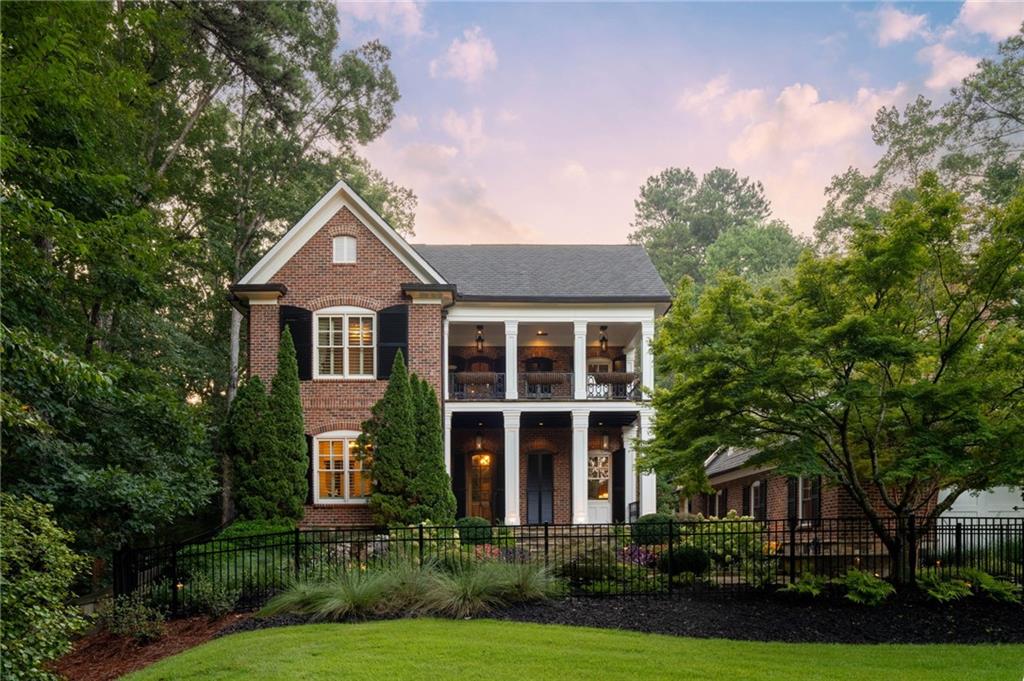 Welcome to this extraordinary custom-built estate situated on nearly 2 acres, just moments from the scenic walking trails of Kennesaw Mountain. Thoughtfully designed with luxury, functionality, and entertaining in mind, this home truly has it all.The heart of the home is the gourmet chef’s kitchen, showcasing Thermador appliances, including a 6-burner commercial gas cooktop, double ovens, warming drawer, ice maker, Sub-Zero refrigerator, and a spacious island that seamlessly opens to the breakfast area and family room. Custom brickwork and rich cherry floors flow throughout the home, adding warmth and character. A large separate dining room offers the perfect space for hosting gatherings, while the family room centers around a stunning custom fireplace with built-ins. A light-filled sunroom overlooks the private backyard oasis, and a handsome study with built-in shelving provides the ideal work-from-home retreat.The primary suite on the main level is a true sanctuary with a spa-like bath featuring a clawfoot tub, separate shower, and an expansive walk-in closet. Upstairs, you’ll find three generously sized bedrooms, each with walk-in closets with ensuite baths.The fully finished terrace level is designed for entertainment with a full entertainment system, pool table, and plenty of space for recreation.Step outside to an entertainer’s dream backyard with a sparkling salt water pool, hot tub, pool house with full bath, outdoor kitchen, putting green, fire pit, and wooded privacy.Car enthusiasts will appreciate the three-car garage with a full apartment above, complete with a kitchen, living area, and bath—perfect for guests or extended family. Across the property, a separate two-car garage offers additional bays with lifts accomodating up to four cars and an upstairs office or storage space.This remarkable estate offers an unmatched lifestyle in a prime location. Don’t miss the opportunity to make this one-of-a-kind property yours!