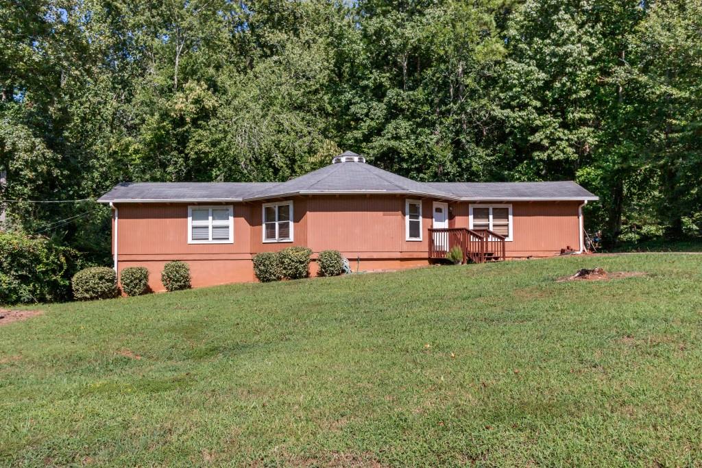 This charming 3-bedroom, 2-bath starter home is nestled in a quiet neighborhood, making it perfect for families or as an investment property. A new roof will be installed, offering peace of mind for years to come. The fenced yard provides privacy and a safe space for children or pets. Located next to Bogan Park, this home is ideal for outdoor enthusiasts. Plus, it's zoned for the coveted Buford schools, ensuring top-notch education. Don't miss this opportunity to own a home in a desirable area with so much to offer!