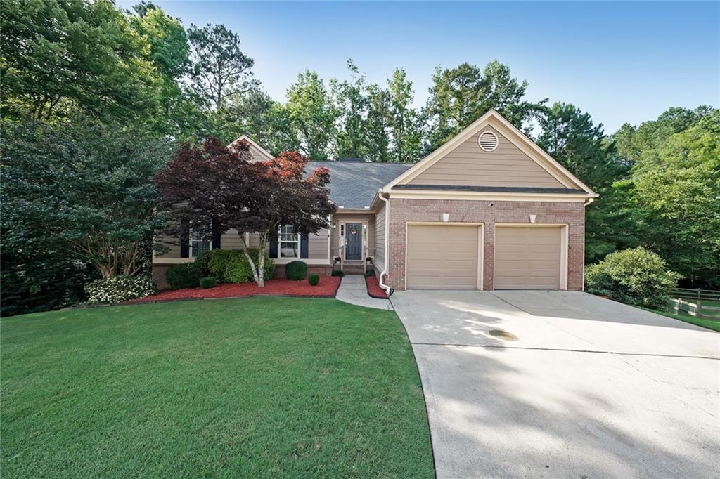 Welcome to this spacious and beautifully maintained 5-bedroom, 3-bath ranch-style home featuring a full finished basement and thoughtful updates throughout. Enjoy a separate formal dining room and a large family room with a cozy fireplace that opens to the kitchen-ideal for entertaining. The kitchen boasts granite countertops, stainless steel appliances, and ample cabinet space. Relax year-round in the bright sunroom with its own fireplace. The luxurious master suite features a spa-like bath with a whirlpool tub, separate shower, and dual vanities. The fully finished basement offers incredible versatility with brand new carpet, a kitchenette, game room, two spacious bedrooms with large closets, a full bath, and a second laundry area-perfect for guests or extended family. Roof is approximately 6 years old. Don't miss your chance to own this exceptional home with space, comfort, and charm!