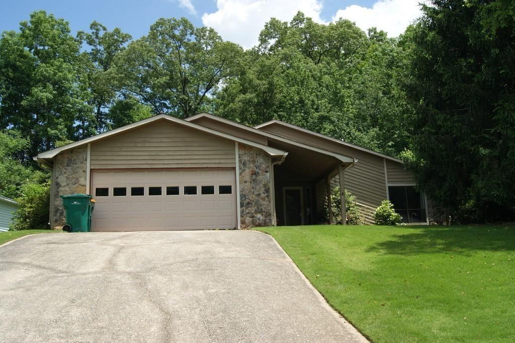 Sq. Ft. does not reflect tiled sunroom. Incredible location with great schools. One level living with tiled sunroom overlooking a private wooded backyard. Vaulted living room with fireplace and ceiling fan; wet bar; separate dining room; 2 car garage; close to shopping, parks, schools and so much more! Principal bedroom with private bath and large walk in closet; professionally managed property; landlord provides trash, yard maintenance and pest control with rent. New double pane windows throughout for efficient living; no carpet in this home. Pet fee is non refundable and not a deposit