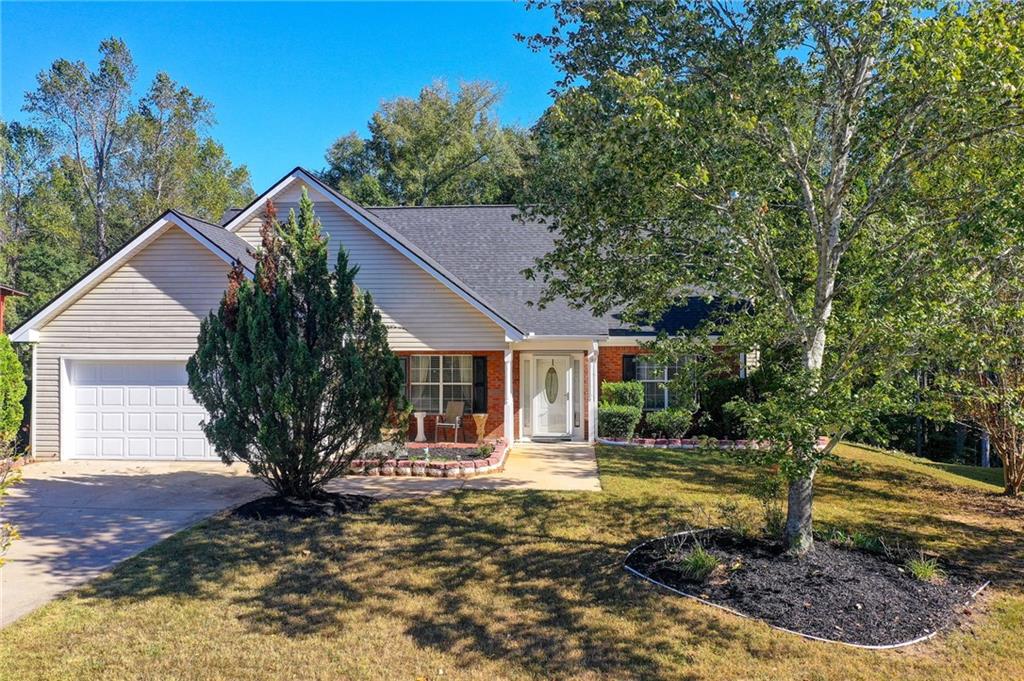 Beautiful and exquisite 3 Bedroom, 3 Full Bath ranch style home that offers a perfect blend of comfort and elegance. Step inside and be greeted by a spacious open-concept floor plan, featuring a separate beautiful formal dining room and a gorgeous family room adorned with a charming wood burning brick fireplace. There are gleaming hardwood floors throughout. The gourmet eat-in kitchen has white appliances and tile floors. The primary bedroom on the main level has an abundance of windows, a large walk-in closet, and a fabulous sitting area. The primary bathroom features double vanities, ceramic tile floors, garden tub, and separate shower. There is a second bedroom on the main with a full bath. Upstairs is an oversized third bedroom with a sitting area, hardwood floors, and 2 large closets (can be a second primary bedroom). Also upstairs is a fantastic loft which can be used as a media room, office, or other flex space. There are ceiling fans in every bedroom. Stepping outside, there is a large 2-car garage, and you’ll enjoy the beautiful manicured front and back yard. The lovely back yard is also fenced, great for entertaining and relaxing. Don’t miss this wonderful home. It is a must see!