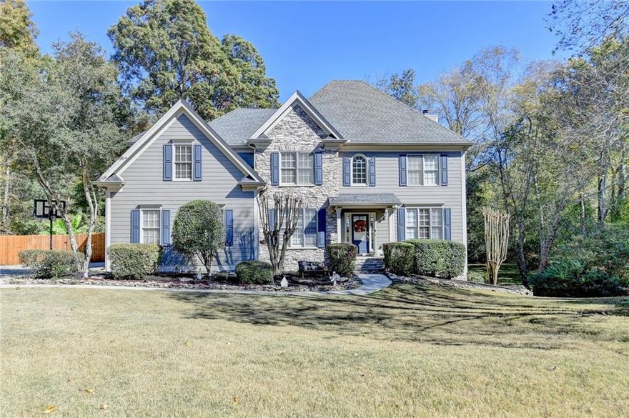 Welcome to Flowers Crossing At The Mill! Nestled on nearly a full acre in a quiet cul-de-sac, this spacious home offers comfort, privacy, and location within the highly sought-after Brookwood School District! Enjoy one of the largest lots in the community—perfect for outdoor activities, play, and entertaining.

Inside, neutral tones and an inviting layout create a warm and welcoming atmosphere throughout the main living areas. The kitchen includes granite countertops, stainless steel appliances, and ample cabinet space.

Upstairs features a generous owner’s suite with a relaxing bath, dual vanities, soaking tub, and separate shower. One secondary bedroom has its own private bath, while two additional bedrooms share a full hall bath.

The terrace level offers plenty of space for recreation, office, or guest use, including a large multi-purpose room, wet bar, full bath, and additional bedroom. The home’s exterior is finished with durable Hardiplank siding for lasting quality.

Community amenities include two swimming pools, a kiddie pool, ten tennis courts, two playgrounds, a lake, firepit, and clubhouse—all located in the award-winning Brookwood School District! Plus-get 1% in closing costs with our Preferred Lender!