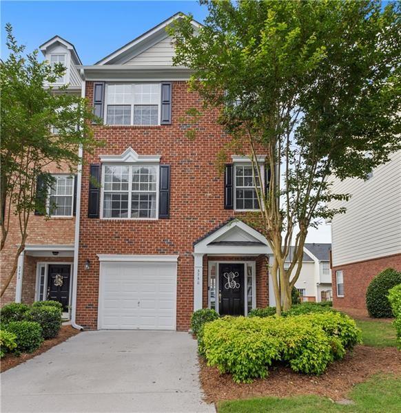 Beautiful updated 3-story END UNIT townhome located within the coveted gated Chattahoochee Bluffs community, nestled within the Chattahoochee National Park. The main floor of this spacious and light-filled home boasts an open floor plan with gleaming chef's kitchen, dining area, breakfast bar, half bath, great room with gas fireplace, hardwood floors, and large windows facing the back deck. Upstairs are two spacious bedrooms both with en-suite baths. The laundry room is conveniently located upstairs between the bedrooms. Extra-wide upper-level hallway for added space. Lower level includes a third full bedroom w/full bath, which can also be used as an office, in-law suite, second den, entertainment room-make it your space! Private exterior entrance as well. NEW ROOFS completed in 2021! Community also provides resort-style amenities including private pool, fitness center, and clubhouse. Community has DIRECT ACCESS to woods and trails leading to the Chattahoochee River National Park and Recreation Area. Also located inside the perimeter, with an Atlanta address yet Cobb County taxes! Just a mile from The Battery, Truist Park, I-285/75, shopping and restaurants. This is truly a gem!