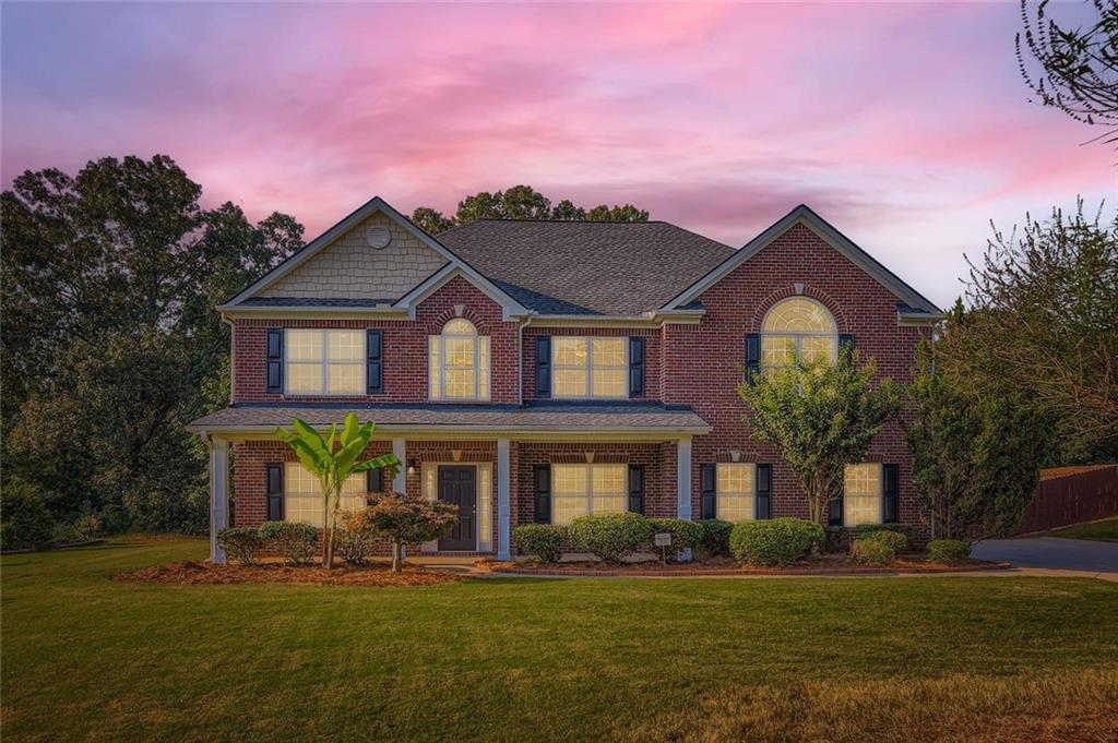 Welcome to this charming 2-story traditional home, perfectly situated on a level, ~1.2 acre lot in a peaceful residential area just outside of McDonough. Boasting classic curb appeal with 3 sides brick and a welcoming front porch, this home offers space, style, and functionality both inside and out. Step inside to find a thoughtfully designed main level featuring a formal living room, a dedicated office space, a separate dining room, and a cozy family room with a fireplace – perfect for gatherings and everyday living. The spacious kitchen is a chef’s dream with stained cabinets, granite countertops, a large center island, and all stainless steel appliances included. A convenient half bath and a two-car garage complete the main floor. Upstairs, retreat to the oversized primary suite with an ensuite bath featuring dual vanities, a separate soaking tub, and a walk-in shower. Three additional bedrooms and two full bathrooms provide ample space for family and guests. Enjoy the outdoors from the rear patio, overlooking the expansive, fenced-in backyard – ideal for kids, pets, or entertaining. With a large yard and over an acre of land, there’s room to relax, garden, or play. Located in a quiet neighborhood with easy access to both I-75 and I-20, this home offers the perfect blend of country serenity and commuter convenience.