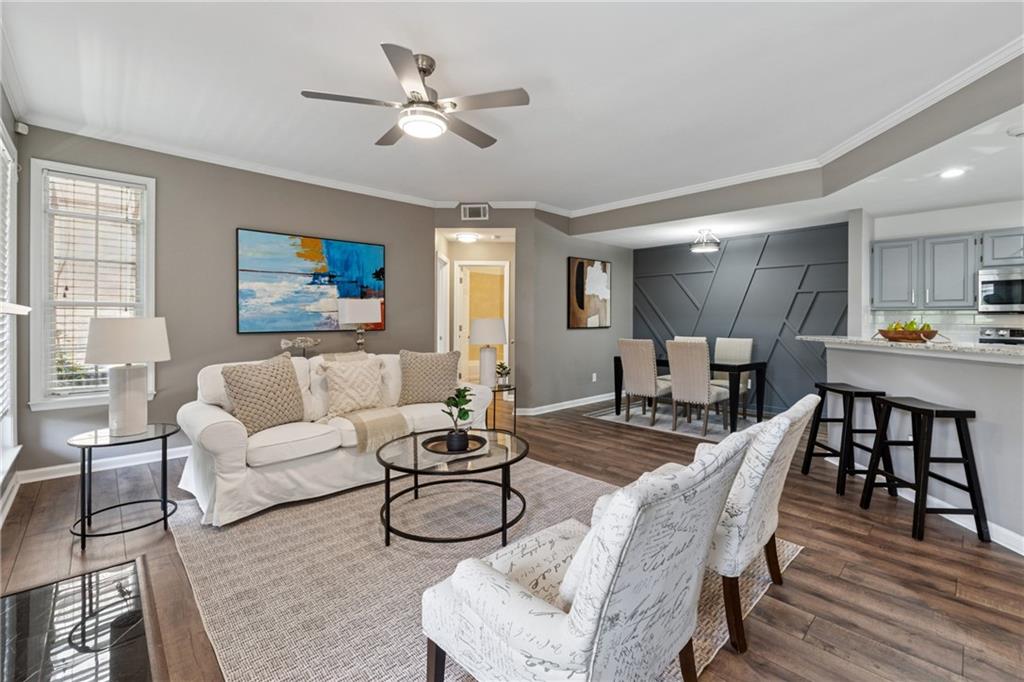 Welcome to 1037 McGill Park, a fully renovated condo tucked inside one of Atlanta’s most beloved gated communities in the heart of the Old Fourth Ward. With 2 bedrooms and 2 bathrooms, this move-in ready home blends Southern charm with city convenience—just the way you’ve been dreaming.
Step inside and you’ll be greeted by all-new luxury vinyl plank flooring, fresh designer paint throughout, and modern light fixtures that brighten every room. The popcorn ceilings are gone, leaving the space feeling fresh, clean, and truly updated. The kitchen shines with painted cabinets, brand-new stainless steel appliances, and plenty of counter space for weeknight dinners or Saturday brunch. Both the primary and secondary bathrooms have been thoughtfully refreshed, so you won’t have to lift a finger—just unpack and start living.
The floorplan is as functional as it is inviting: a spacious living room with a gas-starter fireplace, a large laundry room inside the unit, and a private back patio surrounded by lush greenery—perfect for morning coffee or letting the pup out. Being on the ground floor means easy access to groceries, packages, and parking.
And speaking of parking—there’s plenty of it. You’ll also enjoy all the perks of living in McGill Park, a gated community that feels like a retreat right in the city. Residents enjoy a sparkling swimming pool, gas grills for cookouts, a fitness center, dog runs, and beautifully maintained grounds.
Step outside the gates, and you’re just minutes from everything that makes the Old Fourth Ward one of Atlanta’s hottest neighborhoods: the Atlanta BeltLine Eastside Trail, Ponce City Market, Freedom Park, Krog Street Market, Central Park, Inman Park, and countless restaurants, coffee shops, and local favorites. Whether you’re grabbing groceries, heading to the gym, or enjoying a night out, it’s all at your doorstep.
If you’ve been searching for a renovated condo in Old Fourth Ward with modern updates, outdoor space, and resort-style amenities, welcome home.