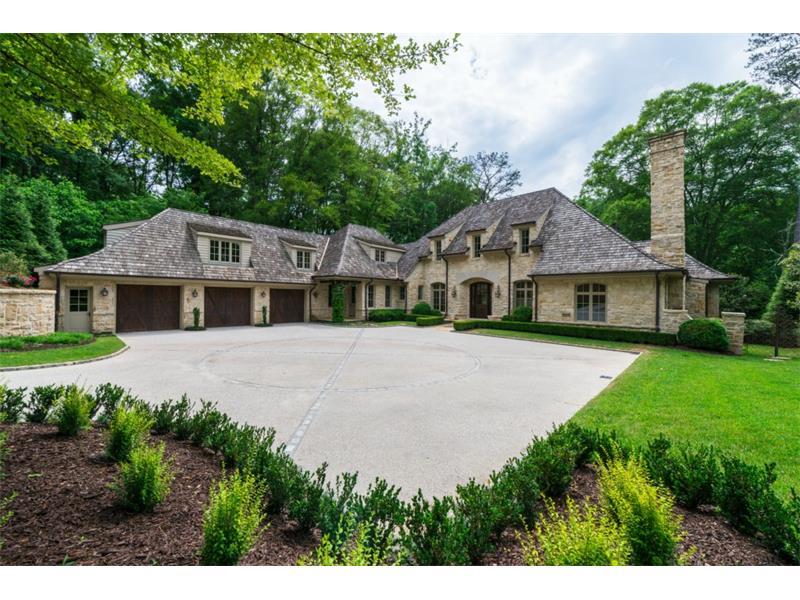 Oh the charm!! This gorgeous European style home is filled with too many custom details to list. Beautifully sited on a private wooded lot, this gated estate is as special on the back as the front with its covered outdoor porch overlooking the beautiful infinity edge pool. The light filled kitchen opens to a breakfast room and keeping room. Large master suite on main with vaulted beamed ceiling and huge closets. Gracious formal rooms, cozy library, full finished terrace level, 2 laundry rooms, high ceilings, stone floors, specialty woodwork throughout.