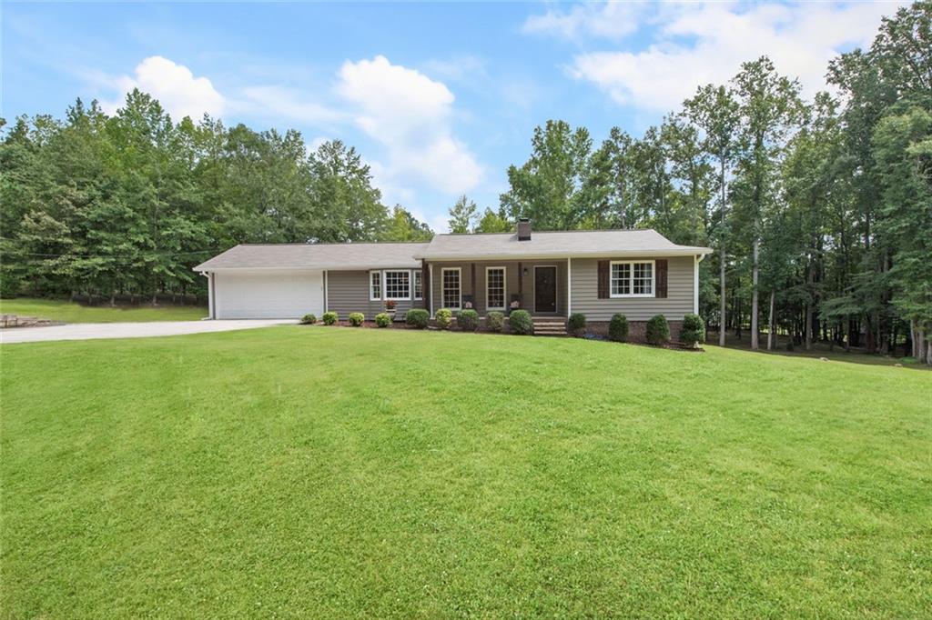 Dream property in the heart of Paulding County! Conveniently located near Hiram shopping, Dallas Hwy, Costco, and more. This private 2.70-acre retreat is exactly what you’ve been waiting for—open, usable land framed by trees, offering the perfect blend of peace and tranquility.
The meticulously maintained ranch-style home features a NEW roof, fresh paint, newer HVAC, and more! Gorgeous, real USA-made Bruce ¾-inch hardwood floors shine throughout the main living areas.
Enjoy a spacious kitchen with updated granite countertops, an island overlooking the breakfast area, and plenty of room for entertaining. Unique character details you won’t find in new builds—wood beams, vintage bath tile floors, and wood molding set this home apart.
The master suite includes a garden tub, double vanities, and a separate shower for your comfort and convenience.
The finished basement offers even more flexibility with space for a potential bedroom, home gym, or office—plus a convenient boat door for easy ATV or equipment storage.
No HOA so you can do your own thing!
Bring your chickens, gardening or any homesteading plans as this property has endless options!
Hurry! This one-of-a-kind home and property won’t last!