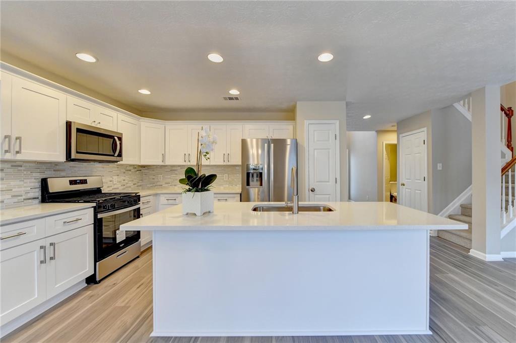 Fully renovated 3-bedroom, 2.5-bath home with stunning views of Dunlin Lake, the neighborhood's lake. This home has been completely transformed with all-new stainless steel appliances, fresh flooring, quartz countertops, updated light fixtures, new paint, blinds, and beautiful wood cabinetry. With no rental restrictions, this property is perfect for investors or homeowners alike. Enjoy modern luxury living in a prime location, conveniently situated near I-85, providing easy access to shopping, dining, and entertainment. Move-in ready and waiting for you! “home offers a 2-1 buy down option”