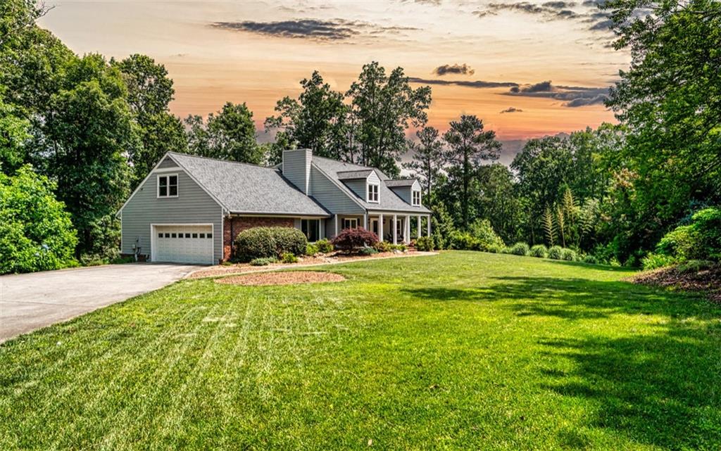 Welcome to your own private almost 2.2-acre sanctuary in the heart of East Cobb, tucked away in one of the area’s most beloved school clusters—Garrison Mill, Mabry, and Lassiter. This warm, light-filled home has been lovingly maintained and thoughtfully updated by its current owners, offering the perfect blend of comfort, space, and connection to nature.
As you step inside, you’ll feel the charm that makes this house feel like home. The traditional layout offers distinct, welcoming spaces that flow beautifully for everyday living. At the heart of it all is the completely renovated kitchen—a bright and functional space where you can start your day in the cozy breakfast nook, coffee in hand, while taking in peaceful views of the wooded backyard.
Upstairs, you’ll find four spacious and comfortable bedrooms, along with three bathrooms—offering plenty of space for rest, privacy, and everyday routines. The storage in this home is exceptional, with large closets in each bedroom, plus a versatile extra storage room on the main level that currently serves as a family organization hub—ideal as an extra pantry or to neatly store appliances, gadgets, and more.
The finished portion of the basement offers even more flexibility, currently set up as an art studio and movie room—ready to adapt to your needs, whether that's a home office, playroom, or creative space. There’s also an unfinished area in the basement that’s been used as a workshop and orchid sanctuary, with potential for future finishing if additional living space is ever desired.
Step outside and you’ll truly appreciate what makes this property so special. Whether you’re relaxing in the nearly new hot tub, entertaining on the expansive back deck, or planning your next garden project, you’ll love the natural privacy and calm of this beautiful lot. And when you’re ready to venture out, East Cobb’s best dining, shopping, and parks are just minutes away.
In the last few years, the owners have completed thoughtful updates, including newer HVAC, a newer roof, all new windows, updated siding, new flooring throughout the second level, and more—giving you peace of mind as you move in and make the space your own.
This is more than a house—it’s a peaceful retreat, a place where memories are made and life can slow down just a bit. If you’ve been waiting for something truly special in East Cobb, this is the one. Schedule your private tour today.