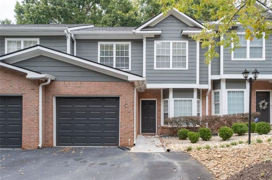 Welcome to this stunning, gated 3BR/2.5BA, townhome, exceptional Location and well maintained, nestled in one of Atlanta’s most well-kept and peaceful communities. Enjoy the best of both worlds, serene, quiet living with unbeatable convenience. This home is ideally located just minutes from major highways, lush parks, top-rated schools, popular restaurants, grocery stores, shopping malls, and entertainment. Step inside to a bright, open-concept white kitchen with granite countertops, a spacious breakfast bar, and stainless-steel appliances. The inviting living room flows effortlessly into a private patio and backyard—perfect for relaxing or entertaining. The master suite features a walk-in closet and a modern, bathroom. Two secondary bedrooms share a fully renovated bathroom, offering comfort and style for family or guests.  Wood flooring on the lower level. Additional highlights include a private garage and no rental restrictions, making this a rare find for homeowners and investors.