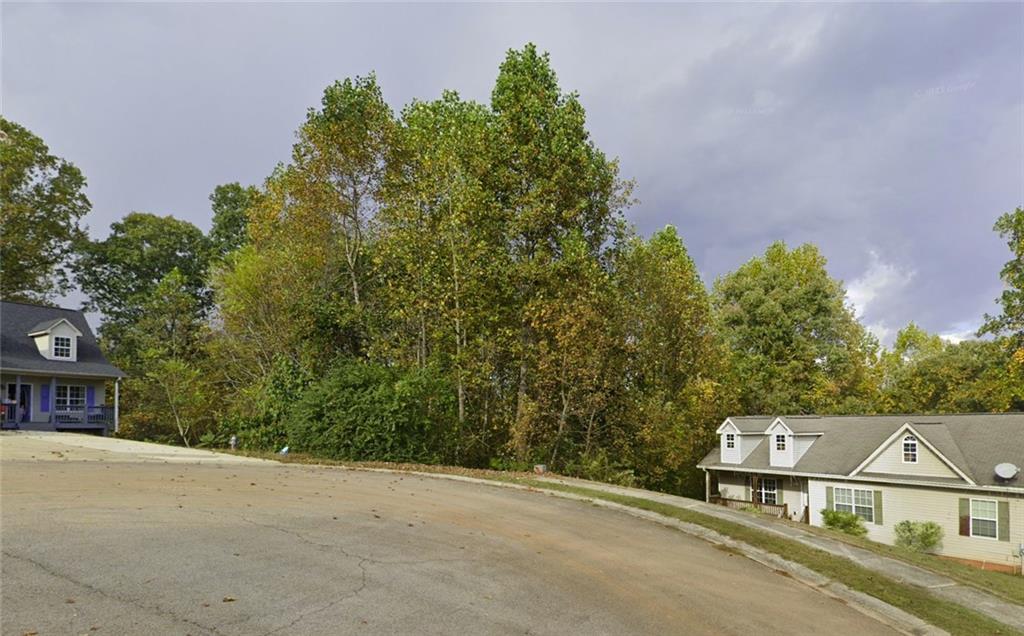 This property is located in a quiet, well-established, subdivision of Pennington Point, Gainesville. Highly desirable Cul-De-Sac lot. NO HOA, Zoned Residential-R-3. Convenient to I-85, HWY 129 South and Sugar Hill Elementary School. Just 19 minutes from downtown Gainesville. Beautiful wooded lot. Come build your new home. Soil test approved for conventional septic system. Good lot for a basement home.