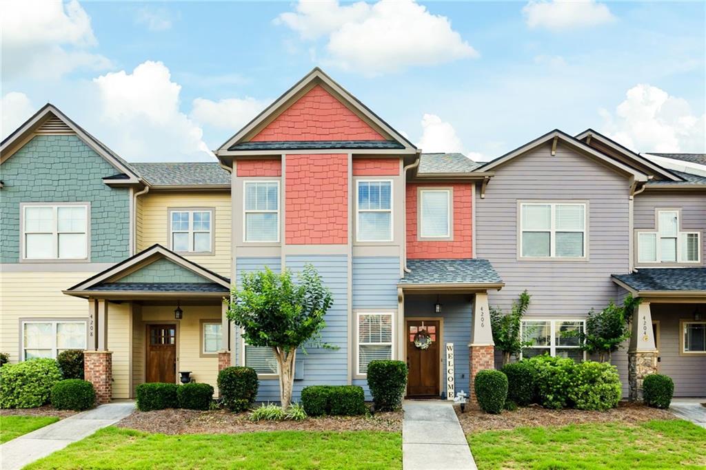 This stunning craftsman-style townhome sits in the sought-after gated community of Lake Acworth Village. The main level boasts a private entry foyer, beautiful hardwood floors and an open layout. The spacious, sunlit family room has a stone fireplace and flows seamlessly into the kitchen and dining area. The kitchen features stained cabinets, granite countertops, a breakfast bar, stainless steel appliances, a pantry and an eat-in dining space. The luxurious master suite is a retreat, showcasing a tray ceiling, a generous walk-in closet, and a spa-like ensuite with a double vanity and separate shower and bath tub. The second bedroom is equally impressive with a large closet, and its own full bath with a tub-shower combo. Both bathrooms have tile flooring and granite countertops. A convenient upstairs laundry sits in between the two bedrooms. This townhome boasts an abundance of closet space throughout, plus the added convenience of a garage, additional driveway space and spacious storage room. ROOF is less than 6 months old! Enjoy the ease of maintenance-free living with HOA perks that include care of common areas, a playground, a pool and clubhouse (steps away), dwelling exterior & grounds maintenance, pest and termite control, plus water and sewer utilities. Located just minutes from I-75, Downtown Acworth, Lake Acworth, and Lake Allatoona, you'll have access to parks, scenic trails, and a variety of local dining and shopping options. Check out the Farmrs Market schedule, Taste of Acworth, etc because you will be a valued part of the booming Community of Downtown Acworth.