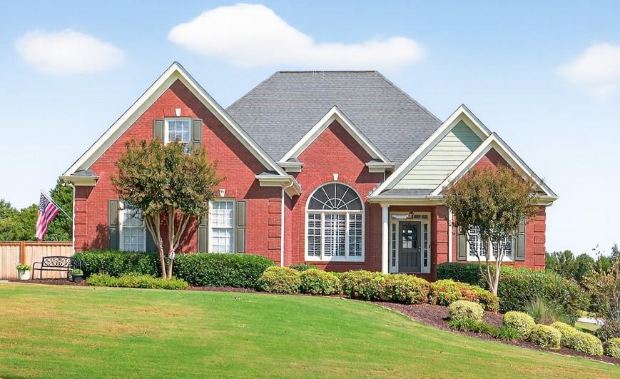 This one checks all the boxes: 3 Levels of Living (including Finished Basement In-Law Suite), Primary Bedroom on Main, Play-Ready Fenced Yard, Workshop Space, Sought-After Swim/Tennis Community, and Desirable West Jackson Location! It's all the space you need! Main Level features Formal Dining Room & Office. Family Room with soaring ceilings, brick gas fireplace, and view into the Kitchen. Kitchen boasts plenty of cabinet & counter space, newer upgraded appliances, additional Office/Coffee Station, and opens into Breakfast Room/Sunroom with natural light pouring in! Primary Suite on main with Ensuite Bath- dual vanities, separate tub/shower, and walk-in closet! Two Secondary Bedrooms on main share Full Bath. Laundry with storage cabinets & utility sink. Upstairs Suite includes Bedroom, Full Bathroom, and walk-in floored attic space for storage. FINISHED BASEMENT! Finished as In-Law Suite: Bedroom, Full Bathroom, TWO Living Areas, and Kitchenette! In-Law Suite has its own driveway & exterior entrance! Additional ~500SF Unfinished Workshop space in Basement with additional garage door (opens to secondary, In-Law Suite driveway) PLUS ~500SF of Unfinished Storage space with shelving. Take your pick for outdoor living: Main Level's expanded, wraparound deck with Trex decking & railing, Lower Level's Covered Patio space, or the flat, spacious, fenced back yard! Premium corner lot with easy access to neighborhood amenities- swimming pool, tennis courts, and playground! Easy access to 85 and all of the shops & dining of Braselton and Hoschton! Zoned for NEW Heroes Elementary & Desirable Jackson County High School!