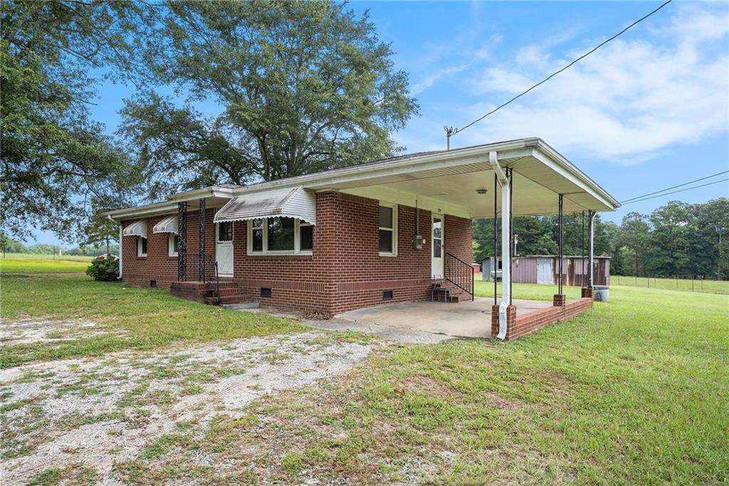 Charming Brick Ranch with Great Bones and Timeless Character – No HOA!
Welcome to 2607 Highway 101 — a classic, four-sided red brick ranch offering potential and charm, situated on a peaceful and level 0.75-acre lot. With only one owner since it was built, this well-loved home is full of character, including peppermint-colored awnings that add a bright, welcoming touch.
Inside, you’ll find original resurfaced hardwood floors, a cozy eat-in kitchen, and a generously sized family room. The bathroom features a resurfaced tub, updated vanity, and new toilet. While the home could use a few personal touches, it stands on solid bones with major system updates already completed:
New roof (2020)
New windows (2006)
Updated electrical wiring
Water heater (2010)
HVAC system (2013)
A tall-ceiling carport provides covered parking, and the surrounding land is privately owned, enhancing the quiet, country-like setting. No HOA means more freedom to make it your own. There’s enough space in front of the carport to park several vehicles.
This home is ideal for a first-time buyer, down-sizer, or savvy investor looking for a low-maintenance property with room to build equity. With its combination of charm, privacy, and practicality, 2607 Highway 101 is a rare find that’s ready for its next chapter.
2607 SR-101 Villa Rica, GA 30180
United States