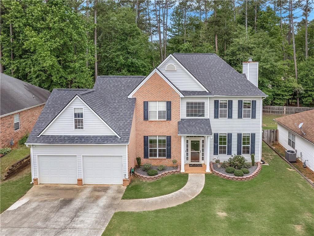 This 2 story home has 4 bedrooms, 2.5 bathrooms and a screened in sunroom to enjoy the family time and/or pets in the fenced in backyard. You will love the natural light and layout of this home. The family room has built-in bookshelves with a cozy fireplace. Recently added can lights in the large kitchen that offers plenty of cabinets and countertops, a large bar top, a breakfast area in the kitchen and a separate formal dining area. All bedrooms are upstairs with a loft/office just outside the main bedroom. Well maintained community close to shopping, restaurants, and TRILITH STUDIOS.