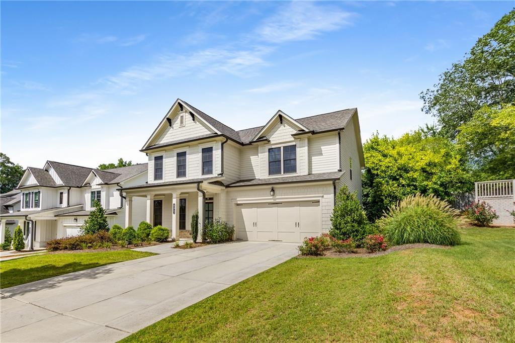 Welcome to 230 Grove Mill Lane, a rare gem in the sought after newer construction community of Avondale East! Thoughtfully designed and beautifully upgraded, this spacious residence offers a true 5-bedroom layout, including a full guest suite on the main level and an upstairs fifth bedroom for a growing family, casual living space or your home office needs!
Entering from the covered front porch you are greeted by an open floor plan, wide-plank floors, and quality finishes throughout. The heart of the home is the gorgeous chef’s kitchen, boasting a large center island, stainless steel appliance package, gas cooking, quartz countertops, and custom cabinetry, all open to the fireside great room and anchored by a separate dining room with gorgeous, beamed ceilings. Step outside to the covered rear porch, perfect for outdoor entertaining, al fresco dining or morning coffee. Enjoy a beautiful, sunny backyard with room to play or garden. A convenient mudroom entry from the 2-car garage offers everyday functionality with stylish appeal.
Upstairs, the oversized primary suite provides a true retreat with a spa-like bath featuring a soaking tub, separate shower, dual vanities, and a large walk-in closet. Three additional bedrooms and a shared Jack and Jill bathroom with double sinks complete the upper level, offering space and flexibility for every need!
Tucked within the welcoming Avondale East neighborhood, less than a mile from the charm and energy of the historic downtown Avondale Estates with restaurants, retail, breweries, community events and the new Town Green. You're just minutes from the DeKalb Farmers Market, multiple parks, the PATH and top-rated schools, with a short commute to Downtown Decatur, Emory, CDC and major highways.
More photos coming soon. This is the one - Welcome Home!