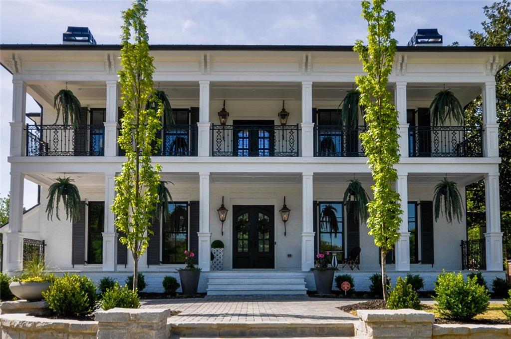 Custom home built with resort style amenities and located in the heart of downtown Alpharetta. Walk to dinner, stores and schools. So much convenience yet with total privacy when you enjoy outdoor dining, pool, and private guest quarters. 12' ceilings on main level, wide and open living spaces, stunning floors, four fireplaces and custom details and features for you to explore throughout. The sub-basement features a collegiate basketball court with 20' walls that can be your home fitness center, basketball court or even golf simulator. The garage accommodates six cars with room for lifts as the ceilings are 18' tall. Private guest suite is a complete house featuring private entrance and outdoor area, gourmet kitchen with dining area, fireside family room, master bedroom on the main with second bedroom and loft upstairs. The main house welcomes you into the kitchen with custom cabinetry, wolf appliances all overlooking breakfast area and living room with sliding doors that all open to covered porch area, dining space, and outdoor pool and hot tub. Upstairs features spacious bedrooms, all bathrooms appointed with beautiful finishes and a recreation room. Master suite with fireplace and sitting area, multiple walk-in closets, stunning master bathroom and covered porch to sit and relax on while overlooking the pool. No detail missed on this spectacular design and construction of this extraordinary home in Alpharetta.