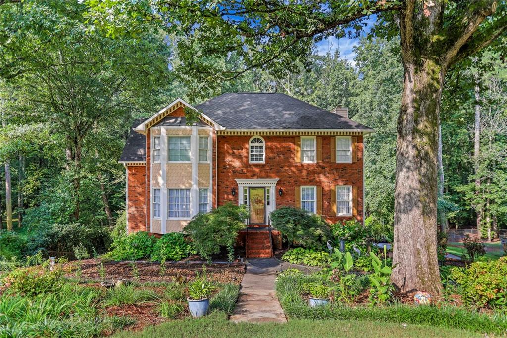 Perfectly situated in East Cobb, this home is a true gem with a must see front and backyard oasis. Mature landscaping, vibrant flowers, and gardens create a setting that feels like your own private retreat. Inside, real hardwood floors throughout, all newer appliances, brand new upper HVAC with a 10 year warranty, two decks overlooking the gardens, and a screened in porch. This home is ideal for entertaining or simply relaxing outdoors. An added third garage for extra storage and flexibility.
This property has been lovingly cared for, filled with memories, and is ready for its next chapter with a new family. Located in top-rated Cobb County schools and close to shopping, parks, and dining, it offers both comfort and convenience. Don’t miss your chance to make this special home your own