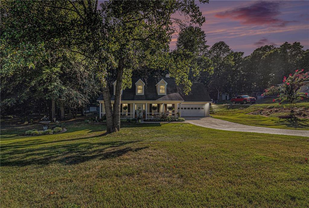 Welcome to this beautifully maintained Cape Cod-style home situated on a generous lot with easy access to the Winder Bypass, local shops, and dining. This inviting home offers a seamless blend of comfort and function with thoughtful updates throughout.
Step inside to find new engineered hardwood floors throughout the main level, enhancing the home's open-concept layout and creating a warm, cohesive feel. Abundant natural light fills the living spaces, making every room feel bright and welcoming.
The owner’s suite is conveniently located on the main level, featuring elegant tray ceilings, a spacious walk-in closet, and a well-appointed primary bath with dual vanities and a walk-in shower.
Outside, enjoy the fully fenced backyard, perfect for pets or entertaining, complete with a new back deck, cozy fire pit, and a large workshop ideal for hobbies or extra storage.
This move-in ready home offers the perfect balance of privacy and accessibility.