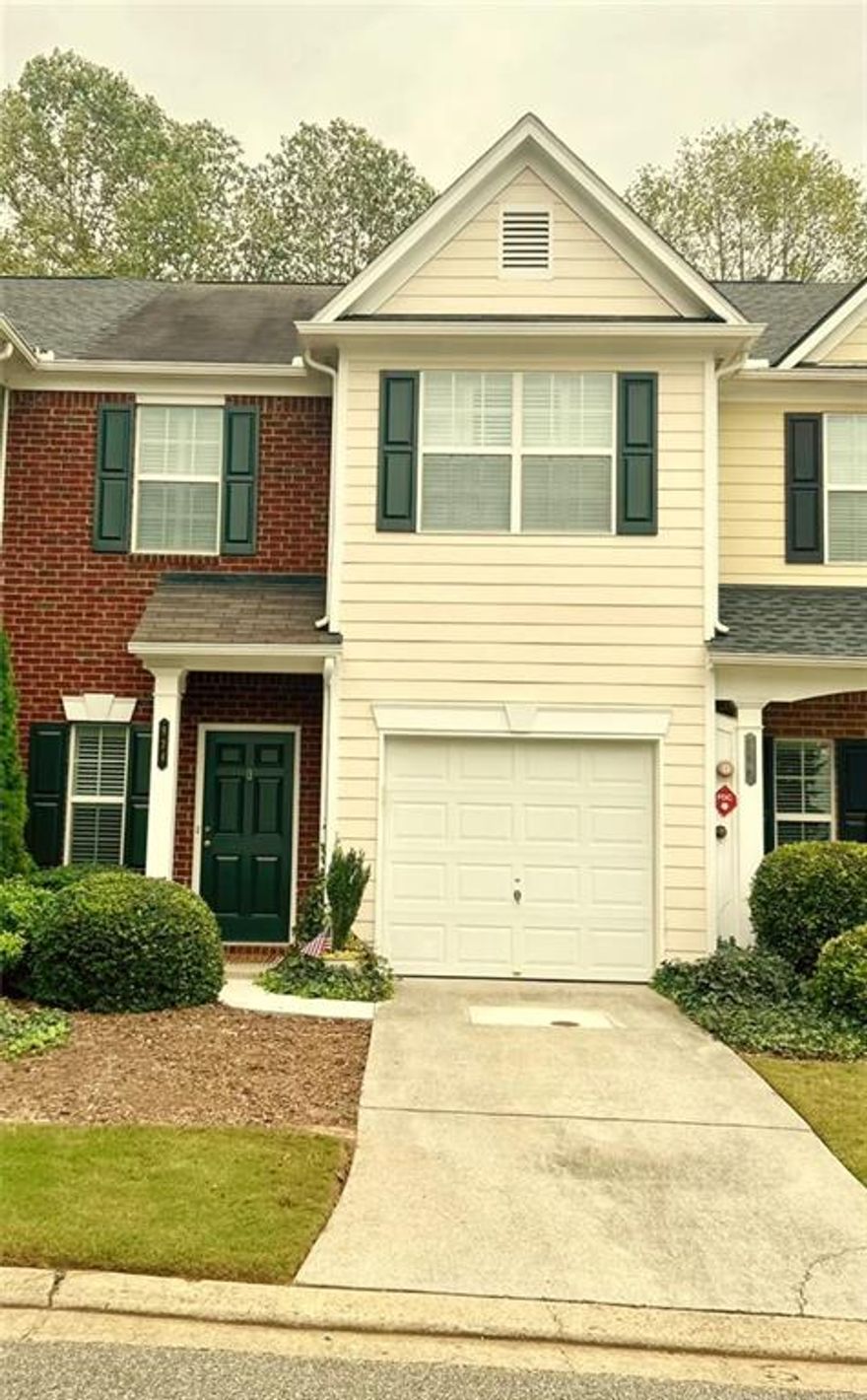 Move-in ready townhome featuring an open-concept main floor with high ceilings, a welcoming two-story foyer, and a single-car garage. The updated kitchen includes plenty of cabinet space and a large pantry—perfect for everyday living and entertaining.

Upstairs offers two spacious bedrooms, each with its own private bathroom and generous closet space. The primary suite includes an updated bath, and the laundry room with full size hookups is conveniently located upstairs for easy access.

Enjoy peaceful wooded views from your private back patio, ideally situated at the end of the street within the community. Rent includes access to all amenities—pool, tennis, lawn care, and trash service. Just one mile from I-575 and The Outlet Shoppes at Atlanta, and minutes from downtown Woodstock’s restaurants, parks, and shopping.