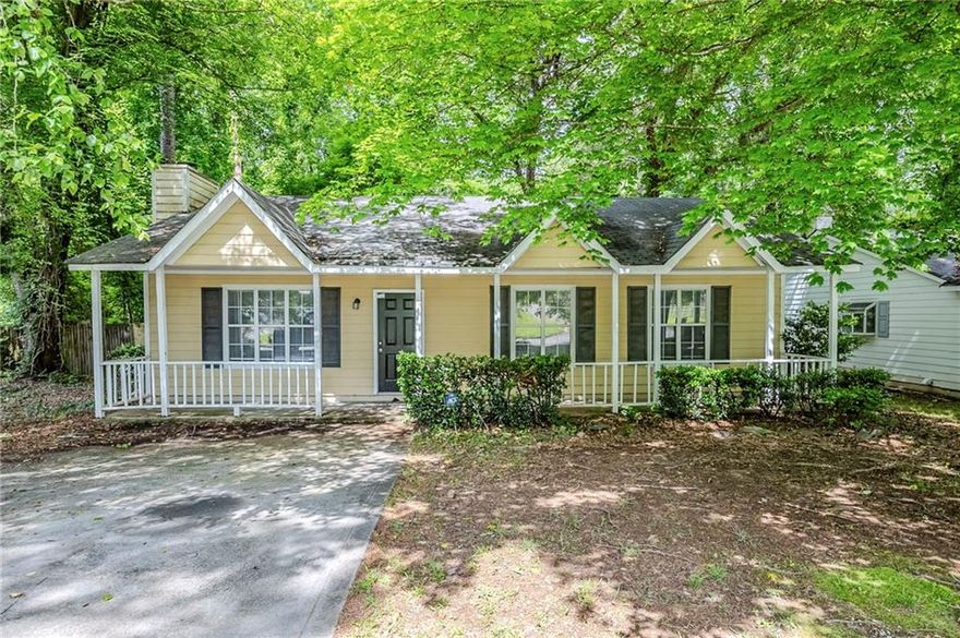 Move-in ready 3-bedroom, 2-bathroom ranch-style home in Lithonia’s Marbut Farms neighborhood! Enjoy charming curb appeal with a welcoming front porch perfect for relaxing. Inside, the living room features a cozy fireplace, ceiling fan, and plush carpeting. The kitchen offers dark cabinetry, black appliances, a convenient eat-in counter, and a laundry closet with hookups. A separate dining area opens to the spacious backyard through beautiful French doors—ideal for entertaining. All bedrooms have standard closets, carpeting, and natural light, while the primary suite includes a double closet and private bath with a shower/tub combo. Don’t miss the large backyard and private driveway—this home is ready for you! Book your tour today!