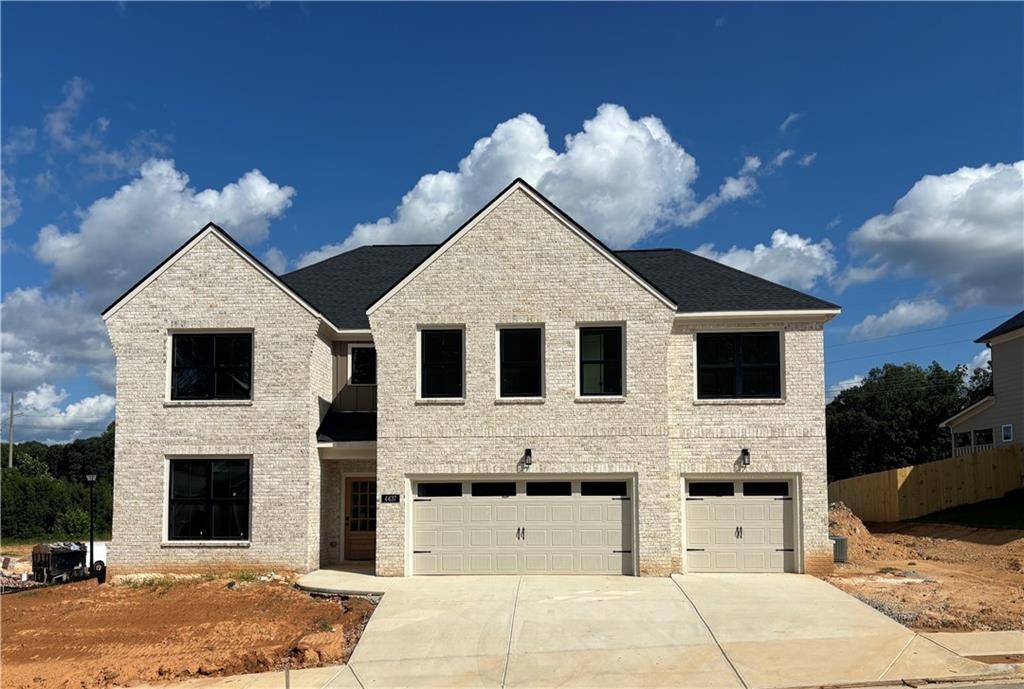 Built by SPI Homes - *Secondary Stock photos. Homesite 43 - this stunning new home in the Phase 2 expansion of Hosch Reserve showcases the Sardis Plan, featuring an all white brick front elevation, desirable corner lot, upgraded gold kitchen cabinet hardware, and an estimated completion date of Sept 2025. Offering 6 bedrooms, 4 baths, 3-car garage, level backyard with railing along retaining wall, and luxury finishes throughout. The main level includes an open-concept living room with a decorative electric fireplace, built in bookshelves, and a luxury kitchen with quartz countertops, a large island with pendant lighting, soft-close cabinets, Samsung stainless steel appliances, a gas cooktop with wall-mounted pasta faucet, wall oven, microwave, and a decorative vent hood. Additional highlights include a bedroom/flex room on the main floor with coffer ceiling, mudbench, & walk-in pantry. Upstairs, the oversized primary suite features a spa-like bath with a freestanding soaking tub, quartz countertops, and an expansive walk-in closet. A secondary bedroom suite and three additional bedrooms with ample space, while the upstairs laundry room adds convenience. Elevated details throughout include shiplap accents, crown molding, coffered ceilings, judges paneling, LVP flooring, blinds on all operable windows, and an included refrigerator. Located in the highly sought-after Seckinger High School district, Hosch Reserve is a vibrant swim, cabana, and pickleball HOA community perfect for active lifestyles. Use Apple Maps GPS address: 3105 Old Thompson Mill Rd. to explore this extraordinary new home today!