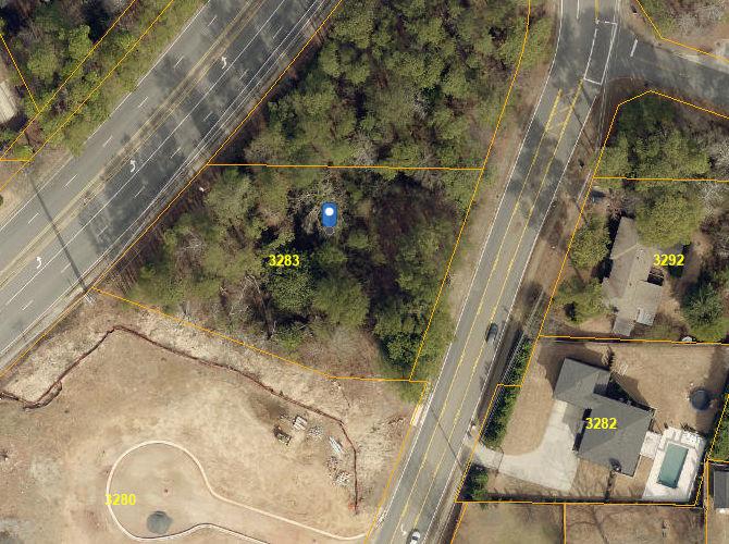 Great lot In East Cobb with double road frontage shared with Sandy Plains Road. Lots of possibilities for this acreage. Topography is very good on this buildable lot.