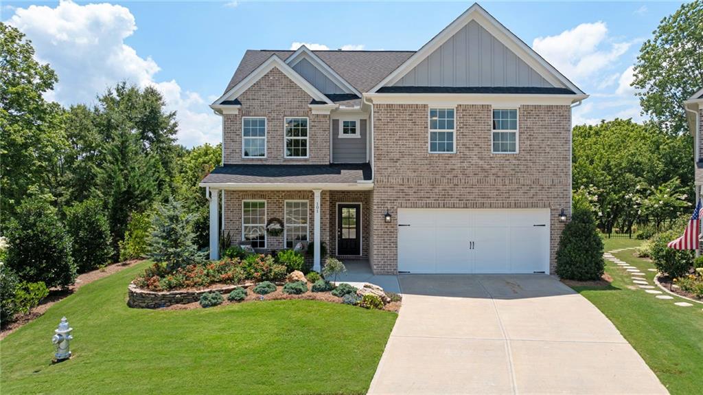 Are you dreaming of GOLF COURSE VIEWS and a PATIO FULL OF BLOOMS? Golfers & landscape lovers will be delighted with this gorgeous home! Welcome home to this meticulously maintained 4-bedroom, 3.5 bathroom home with a STUNNING PATIO that will feel like your own personal sanctuary. Located in the highly desirable Woodmont Golf & Country Club community, you will enjoy golf course views from your front yard and the back yard! Walking out your front door, you see the expansive Woodmont Golf Course with views of the clubhouse. The home is also on the golf course - but, has the benefit of lots of tree privacy so seasonal views are available in the backyard. Surrounded by perennials, that will come back every year, this yard will make you want to spend all your time outside. With an OPEN CONCEPT kitchen that extends into the cozy living room with the fireplace and a sun room to bring the outdoor views to you! This home is perfect for entertaining in every season. The MASTER ON MAIN also has garden views to the patio and a large bathroom. This home has TWO SEPARATE HOME OFFICE SPACES on the main level! The laundry room is on the main floor and comes complete with a wash sink. On the second floor, you have another large family room, a SECOND MASTER bedroom and bathroom, along with two additional bedrooms and another full bath. The garage has been extended to give you more storage, has granite epoxy floors and an additional sink there as well!