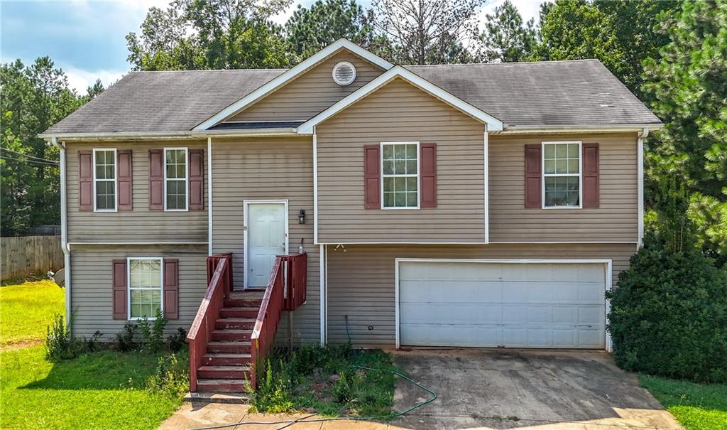 Investor Special! Fantastic opportunity to own a 4-bedroom, 2-bath home in Covington with tons of potential! This split-level property features a spacious layout, large backyard, and great bones — ready for your personal touch. Priced below market to reflect needed updates, making it ideal for investors, first-time buyers or savvy homeowners looking to build equity fast. Located in a quiet neighborhood with no HOA, this home offers a great return on vision. Comps in the area are in the $250K+ range — this is your opportunity to build instant equity.
