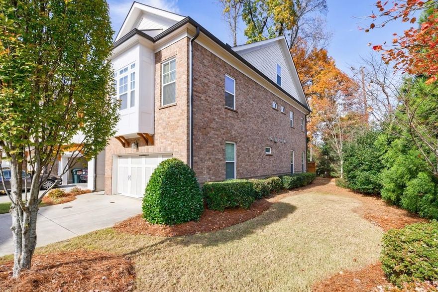 Luxurious modern END UNIT townhome in coveted Alpharetta/Johns Creek location!  Gated community, excellent schools, great floor plan with in-law/teen suite, fantastic location!  This home has barely been lived in (the oven has never been used).  Open floor plan, beautiful hardwood floors, kitchen features quartz countertops, a large island and lots of cabinets. Three levels of living space.  The fireside family room is flanked by built-in bookcases and opens to a beautiful fenced patio with nature surrounding it. The primary suite upstairs is oversized, and features a soaking tub, large shower and large closet.  Two additional bedrooms and a full bath share the second level. The third tloor features a huge bonus room and bath, which is perfect for a teeen/guest suite, media room, flex space.  So much potential!  Terrific location - walk to shopping and dining. 10 minutes to Avalon, 15 minutes to Downtown Alpharetta!  Welcome home to your new carefree and convenient lifestyle.
