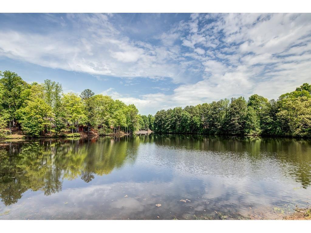 Great Location & Quiet Living! Come see this 3BD/2BA condo in one of Atlanta's best kept secrets, the Gardens! This unit is perfectly located at the Perimeter just steps to grocery stores, restaurants, offices Perimeter Mall, & MARTA. Neighborhood amenities include 4 lighted tennis courts, pool, 24 hour gym, clubhouse, and 2 beautiful lakes on 7 acres. Easy access to 285 & 400 to get anywhere. Unit features granite countertops, outdoor patio, and great community amenities! Laundry machines included. All furniture can stay with unit at no extra cost.