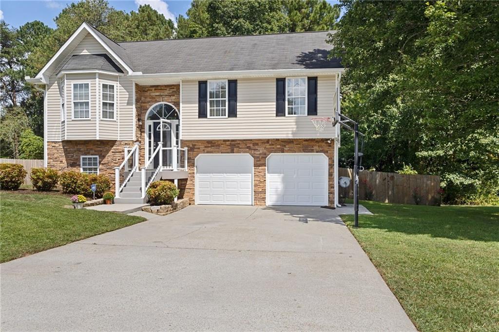 And THIS is why you purchase a house in rural Georgia. This retreat home would easily sell for $75K-$100K more than this list price just a few miles closer to the metro area, and for good reason! You just absolutely won't believe what you get for this price! Almost 2000 sf of completely remodeled beauty. New EVERYTHING! Hardwood flooring throughout, custom cabinets, quartz countertops, new fixtures, newer HVAC, new septic drain field lines, fresh paint, and even new insulation in the attic! Can we talk about the outdoor oasis for a minute?! 600 sf of two-tiered composite deck with PVC railing (I could talk about the benefits of this forever) overlooking a 27 foot salt water pool with heater, AND a low-maintenance 6,000 gallon Koi pond with waterfall and filter! All of this is fully fenced in on almost a half an acre with privacy fence! 3 gorgeous bedrooms and 2 stunning bathrooms upstairs PLUS a huge bedroom/office/bonus room/mother-in-law suite/teen suite/man cave or craft room downstairs with it's own private bathroom. The freshly epoxied garage floors are so clean you may feel a little guilty even stepping on them! Did I mention NO HOA? Another benefit of Rockmart? While it is growing, and one of only a few towns/cities projected by Zillow to increase in value over the next year, it still qualifies for a ZERO PERCENT down payment with a USDA loan! If this lasts 5 minutes, I'll be surprised!