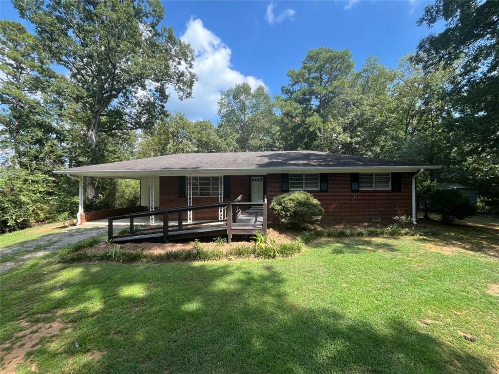 4-sided brick house set on 2.5 private acres across from Rush Chapel Methodist Church. New kitchen with stainless appliances, hardwood floors. This is the first time house has ever been for sale since being built. This house sits up on a hill and is not visible from the road, it is a very peaceful and quiet location. USDA loan eligible