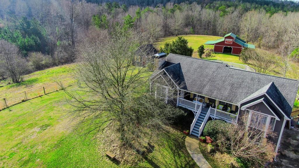 Gentleman's Equestrian Farm could be the perfect Family Compound or get away. Enter the tree lined gated drive and escape to this self sustaining farm. 7 Acres mostly cleared Pasture and Riding Arena. Barn features power and water, 4 Double Size Stalls, Hay storage in the Loft, and rear and 2 side covered Pavilion with amazing Sunset Views. Two separate fenced Pastures, Tack House / She-shed, & oversized Deck. Updates to the main kitchen include new appliances and quartz counter tops. Updated Baths, New Flooring throughout, 2 masonry Fireplaces, new Paint, Tile Flooring, 2nd Full Kitchen on the Terrace Level, and oversized Deck. Other possible uses for the property- B & B bring your horse, Wedding venue, and the list goes on and on.