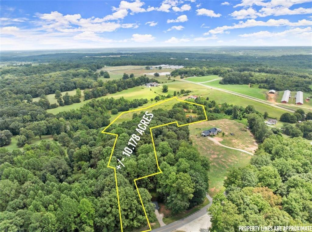 Discover 10+ acres of serene privacy in Danielsville, Ga featuring a mix of wooded areas and open pasture, complete with an on-site pond and offers the perfect setting to build your dream home or establish a hobby farm farm. With no HOA restrictions, you're free to bring your animals and enjoy endless possibilities. Enjoy quiet country without losing the convenience of being close to schools, shopping and restaurants, also convenient to I-85.