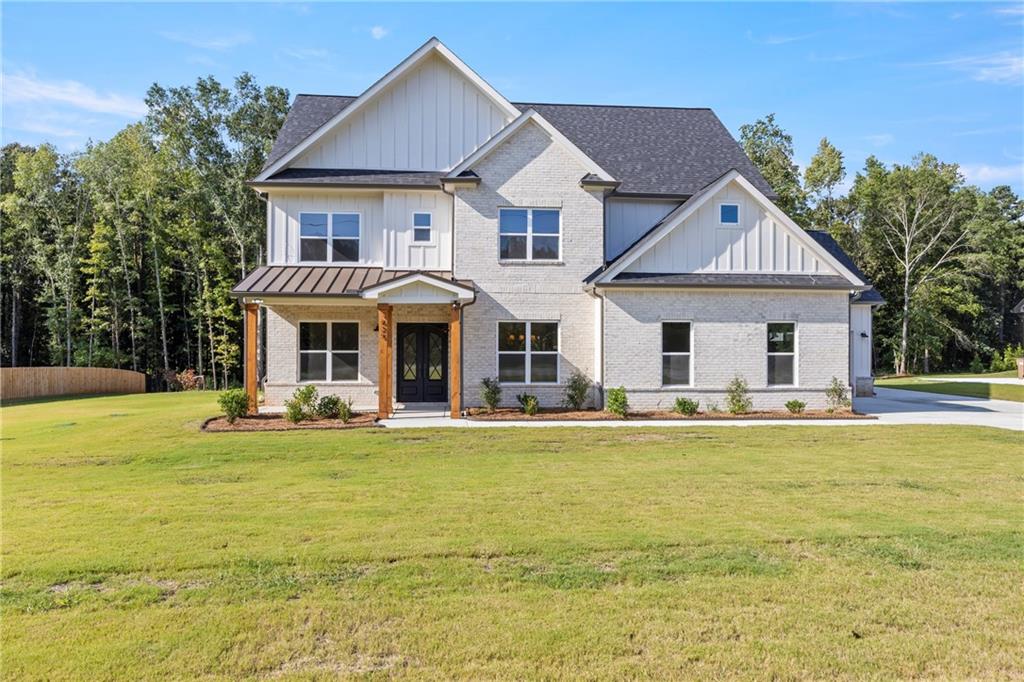This beautiful brand-new construction home offers nearly 3,500 square feet of thoughtfully designed living space on a full acre with no HOA restrictions. Featuring 4 spacious bedrooms and 4 full baths, plus a versatile media room with a closet that could easily serve as a 5th bedroom, this home was built with both style and functionality in mind. The wide-open floor plan is perfect for gatherings and entertaining, highlighted by beautiful white oak hardwood floors and designer-selected finishes, including custom cabinets, curated fixtures, elegant tile, rich paint colors, and statement lighting throughout. Enjoy seamless indoor-outdoor living with a huge covered back patio and a welcoming covered front porch, each accented with real wood beams and custom wood ceilings for a truly custom touch. Blending luxury details with everyday livability, this property delivers both freedom and privacy—an opportunity to own a one-of-a-kind home without the constraints of an HOA.