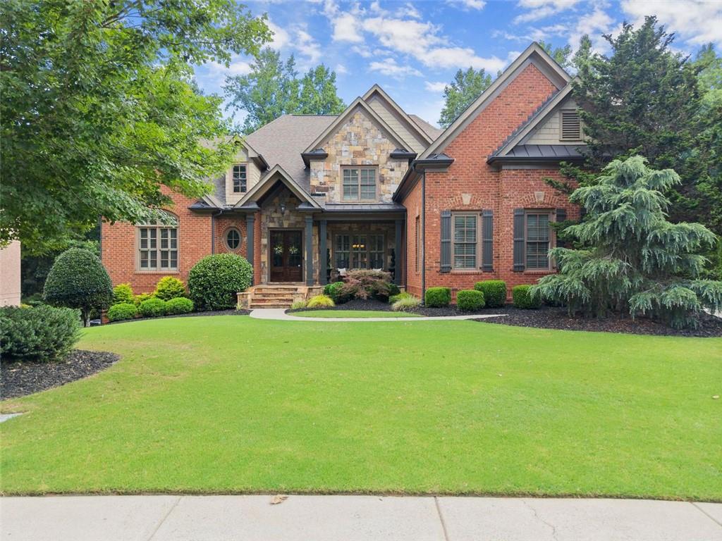 The search is over!
This exquisite home in Suwanee is located in the exclusive gated Edinburgh neighborhood, home to Jack Nicklaus' Bear's Best golf course. Beautiful design with a finished terrace level and pool area with outdoor kitchen and fire pit. Primary bedroom is on main level. Gigantic entertaining kitchen. Home theater with tiered seating. Custom terrace level bar. The house exemplifies craftmanship and attention to detail that has become so rare. This extraordinary estate home is located in one of most sought-after districts in Georgia as well as an active tennis and swim community. So much more... Please schedule an appointment today.