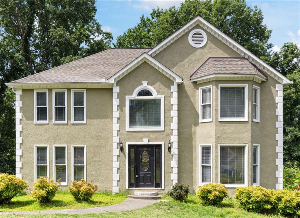 If you’ve been searching for space, flexibility, and a fantastic location - take a look at this one! This home has room for everyone with 5 true bedrooms and an optional 6th, plus multiple living spaces that can adapt to your lifestyle.
The main level makes a great first impression with real hardwood floors throughout and a wide entry flanked by a spacious dining room on one side and a light-filled office or flex space on the other. You’ll love the kitchen where there is plenty of space for everyone with granite countertops, double ovens, tons of cabinet storage, and an eat-in area. The living room is large and welcoming with plenty of natural light and space to spread out or entertain. French doors open out to a spacious back deck - great for morning coffee or hosting friends.
Upstairs, you’ll find three secondary bedrooms (plus a bonus that could be a 4th), and a generous primary suite with two closets and a unique double vanity setup - perfect for not bumping elbows in the morning. There's also a big soaking tub and separate shower.
The finished basement has a drive-under garage and two additional bedrooms already done, making it ideal for guests, a home gym, or extra office space.
Kingston Square is a well-established swim/tennis neighborhood close to everything - shops, restaurants, downtown Woodstock, and easy access to I-575. Plus, you’re not far from the pool area, which is a nice bonus.
If you're looking for a home with great bones, tons of space, and a location that makes life easy, this one worth checking out.