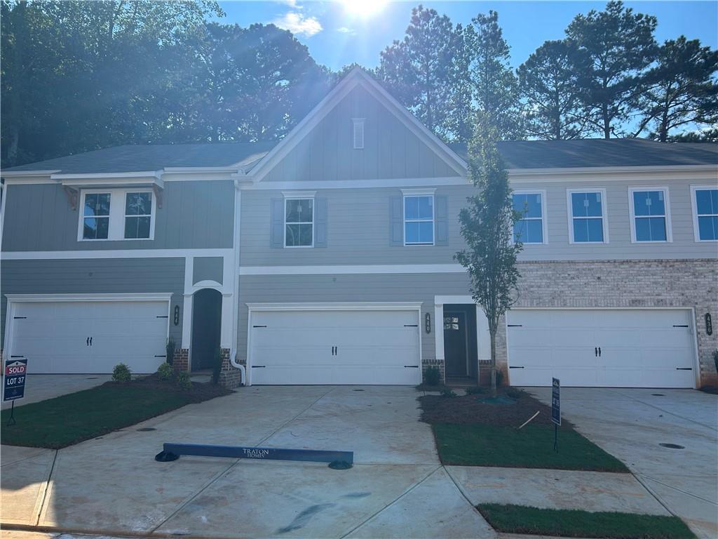 Traton Homes welcomes you to Cherokee Township located in Acworth, Georgia. Home will be ready in September! Our Brooks E floor plan will be ready to close in September! This community offers luxurious 2-story townhomes and is ideally located near major thoroughfares including Hwy 92, I-75 and I-575 with easy access to endless shopping and dining options in Downtown Acworth, Downtown Woodstock and the Outlet Shoppes in Woodstock. The Brooks plan features 3 bedrooms w/ 2.5 baths. Main floor features LVP flooring, 9ft ceilings, open kitchen with oversized island and large walk in pantry. Hardwood stairs lead to spacious Primary suite w/ enormous walk in closet & lovely Primary bath. Two additional generous size bedrooms are set away from primary bedroom for privacy. Versatile loft area, laundry room and full bath complete the upper level. Outdoor living includes a 16x8 patio for entertaining, grilling or hanging out for some sunshine! Ready in September! Decorated model open daily!
