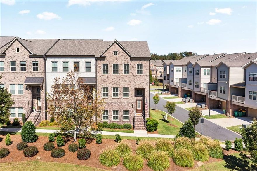 Better Than New Townhome in Prime Downtown Woodstock Location! Welcome to luxury low maintenance living that is just a short distance from the vibrant shops, dining, and entertainment of Downtown Woodstock. This beautifully end unit home is an upgraded 4 bedroom, 3.5-bath townhome that is really better than new, featuring high-end finishes and upgrades throughout, don't miss the custom plantation shutters. The open-concept floor home features an entry-level guest suite with a full bath, perfect for visitors or a home office. The chef’s kitchen is one of the "WOW" factors in this home. It is a standout with custom cabinetry, premium appliances, flooring, keeping room/sitting area and so much more.  The sunny bright in breakfast area is large and spacious. The family room offers space, gas starter fireplace and custom flooring. The spacious master suite features a custom walk-in closets and lead to your private spa-like bathroom. All upstairs bedroom are spacious with plenty of space and storage. Outdoor living deck is on the second level and is perfect for the morning coffee or evening gatherings. This home has it all and combines convenience, luxury, and a walkable lifestyle in one of Woodstock’s most desirable communities. Amenities, including a pool and clubhouse, you will not find faster highway access. The location is perfect and don't miss the new Publix grocery store coming to downtown and will make living in this home even more convenient desirable. Another bonus in this home is bring your electric car we have the charger installed for you.  Call today to view this better than new home in the heart of Woodstock.