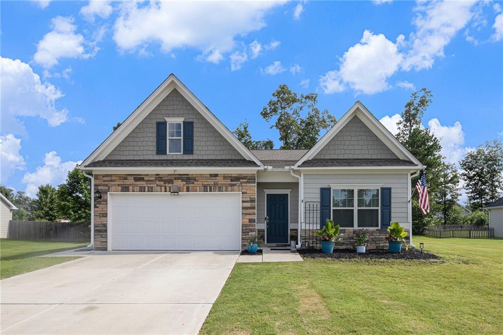 Welcome to this beautifully updated 3-bedroom, 2-bath ranch home built in 2021! Featuring a spacious open-concept layout, this home offers a stunning kitchen with white cabinets, granite countertops, stainless steel appliances, and a large breakfast bar—perfect for entertaining. Enjoy relaxing mornings or evening gatherings on the covered back patio. With modern finishes throughout and single-level living, this move-in ready home offers comfort, style, and convenience all in one.