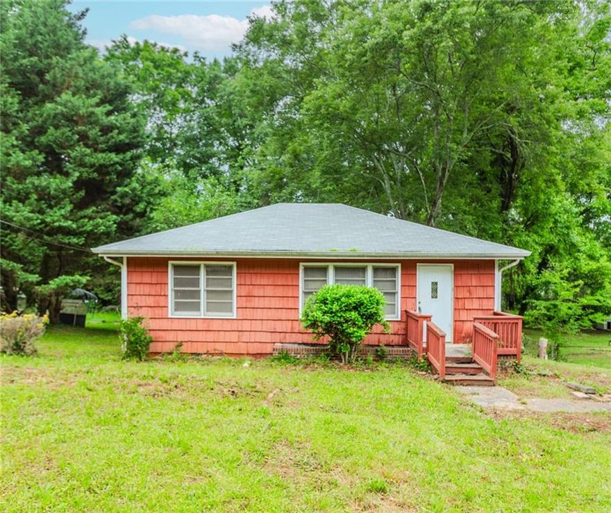 Charming Marietta City bungalow just minutes from Marietta Square! This cute 2-bedroom 1-bathroom Marietta ranch is in the perfect location. A blank canvas ready for your personal touch!!! The spacious rear leveled backyard offers great outdoor entertaining options. This property offers fantastic flexibility, and its convenient location places you close to I-75, Marietta Square, Wellstar Kennestone Hospital, KSU's Marietta campus, and The Battery. A perfect opportunity for first-time homebuyers to finish and renovate or savvy investors to put your finishing touches on this home! Convenient to schools, shopping, and highways, this home will not last long! There is enough room in the back to add another huge room and a bathroom if you need more room. Expand your rental portfolio or make this charming house your new home! This home offers endless possibilities. Whether you're looking for an income-generating property or a place to call your own, this home is full of potential. Don't miss out on this fantastic opportunity!